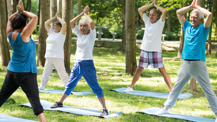 Seniors doing exercise in the park