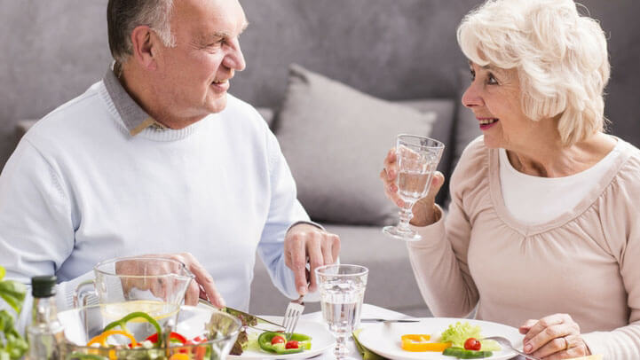 A senior couple having dinner