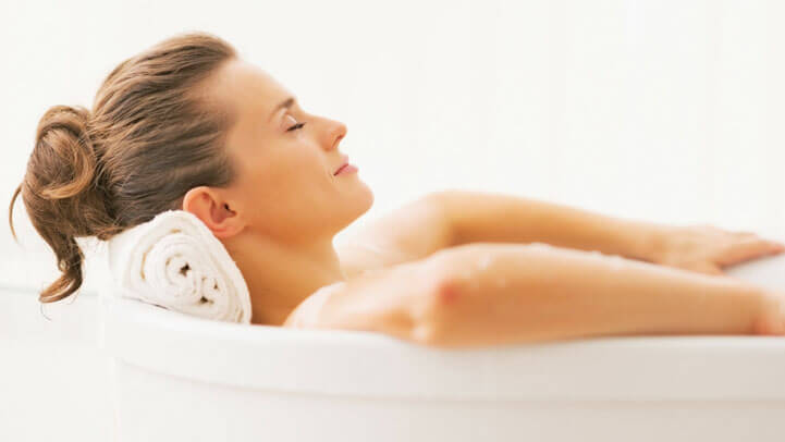 A woman relaxing in the bath