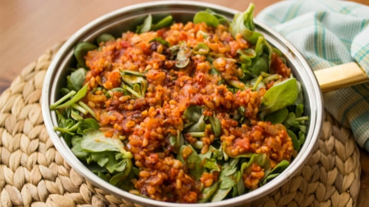 Purslane food with tomato sauce in a pan