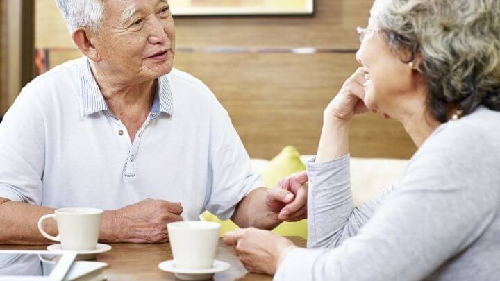 An elderly couple having tea