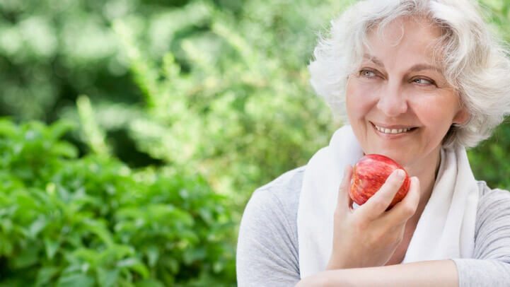 A woman eating an apple