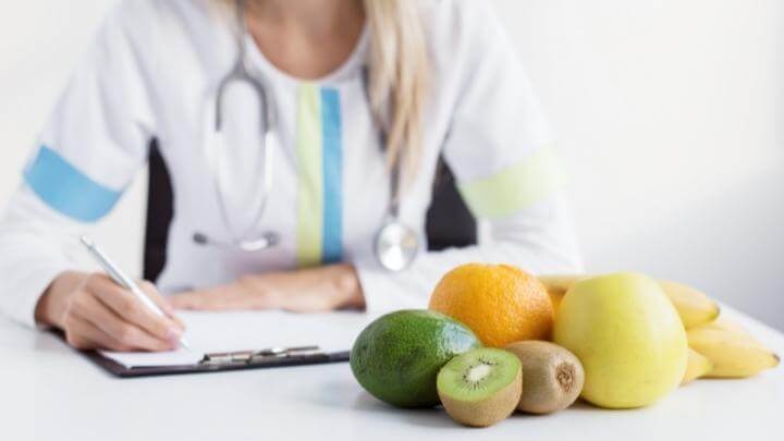 Female nutritionist taking notes