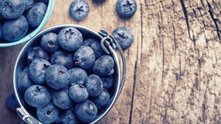 Blueberries in a bowl on a wooden table