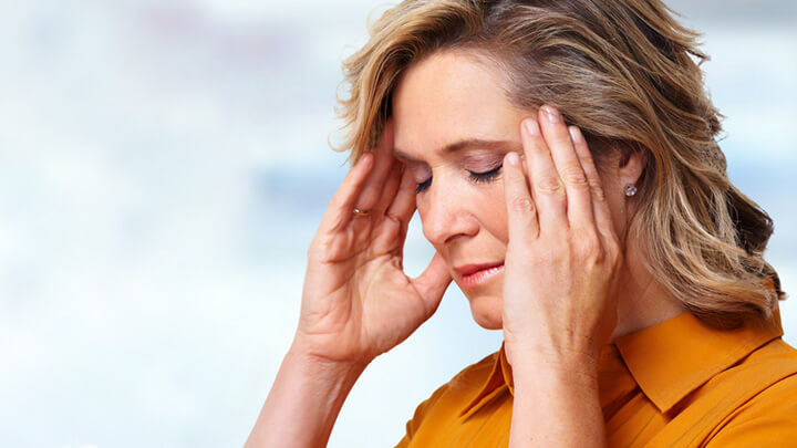 A middle aged woman with headache