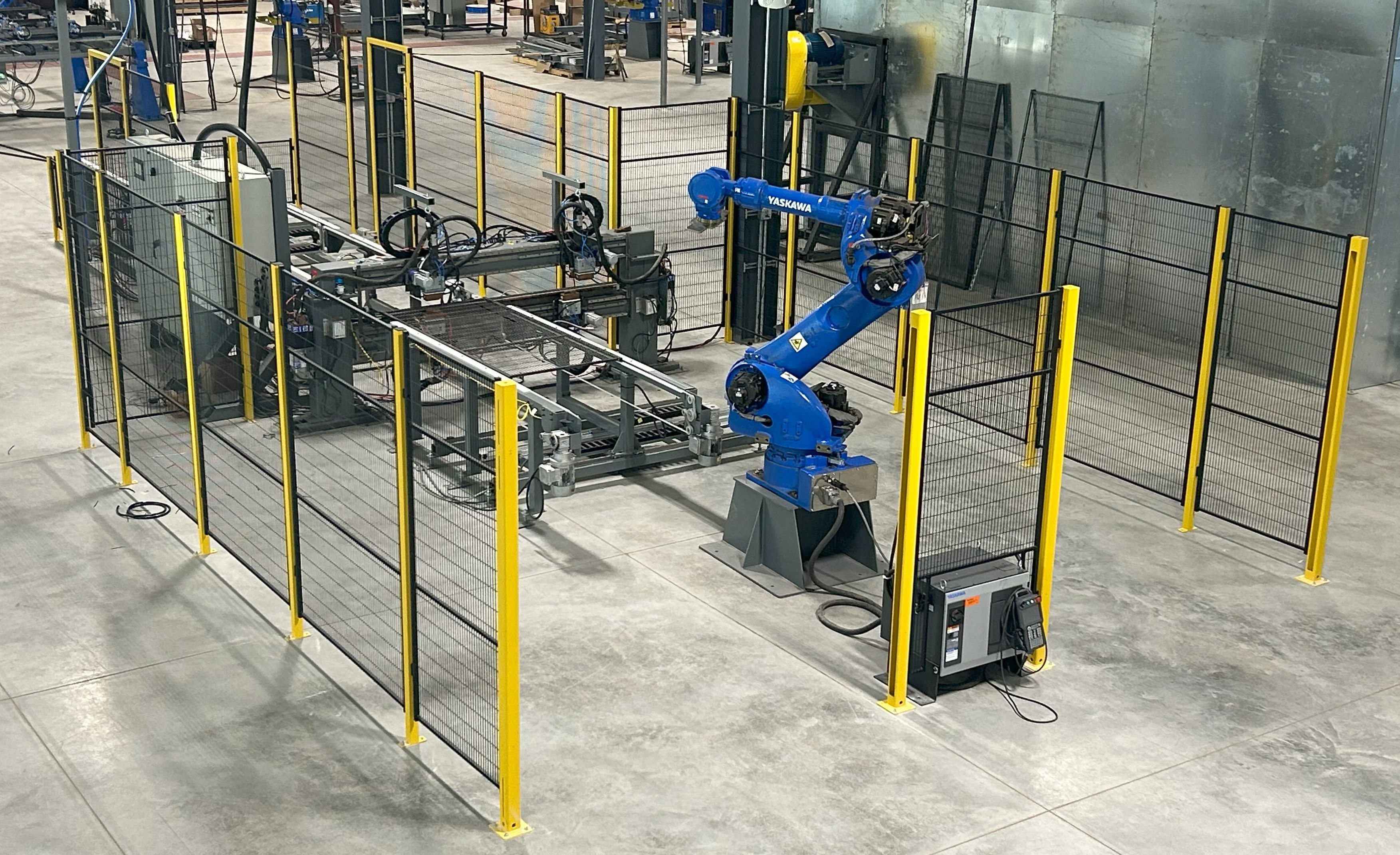 Industrial robotic cell with safety guarding, interlocked doors, and area scanners