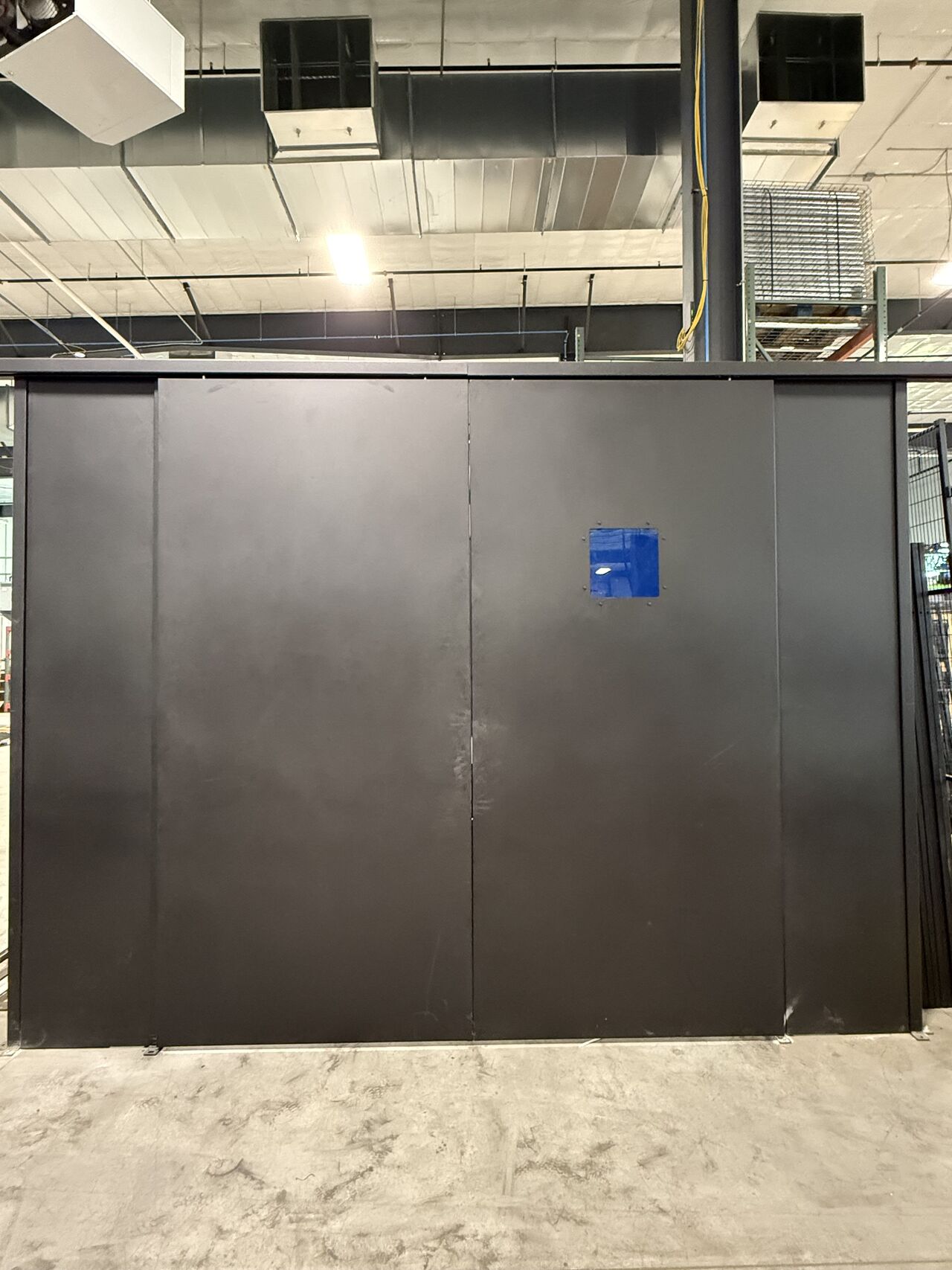 Laser safety room dual sliding doors and interlocks