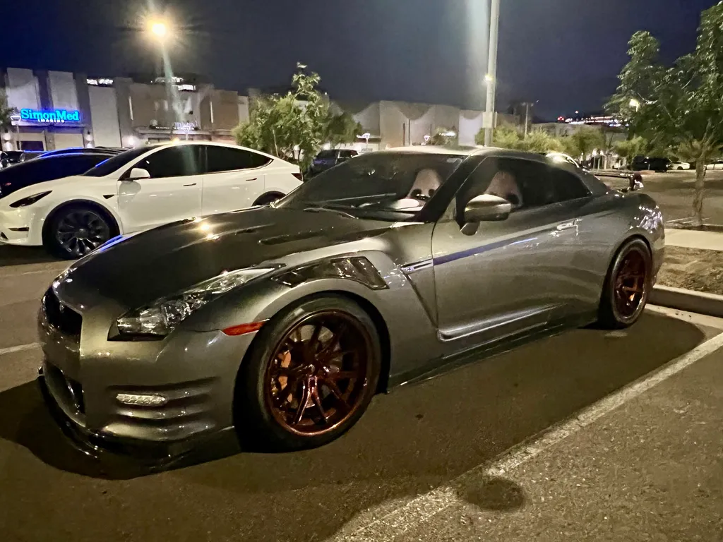 Before: Grey sports car at night