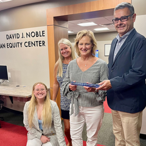 Elizabeth, Joni and Cindy Noble, on behalf of The David J. Noble Foundation, with Dean Alejandro Hernandez