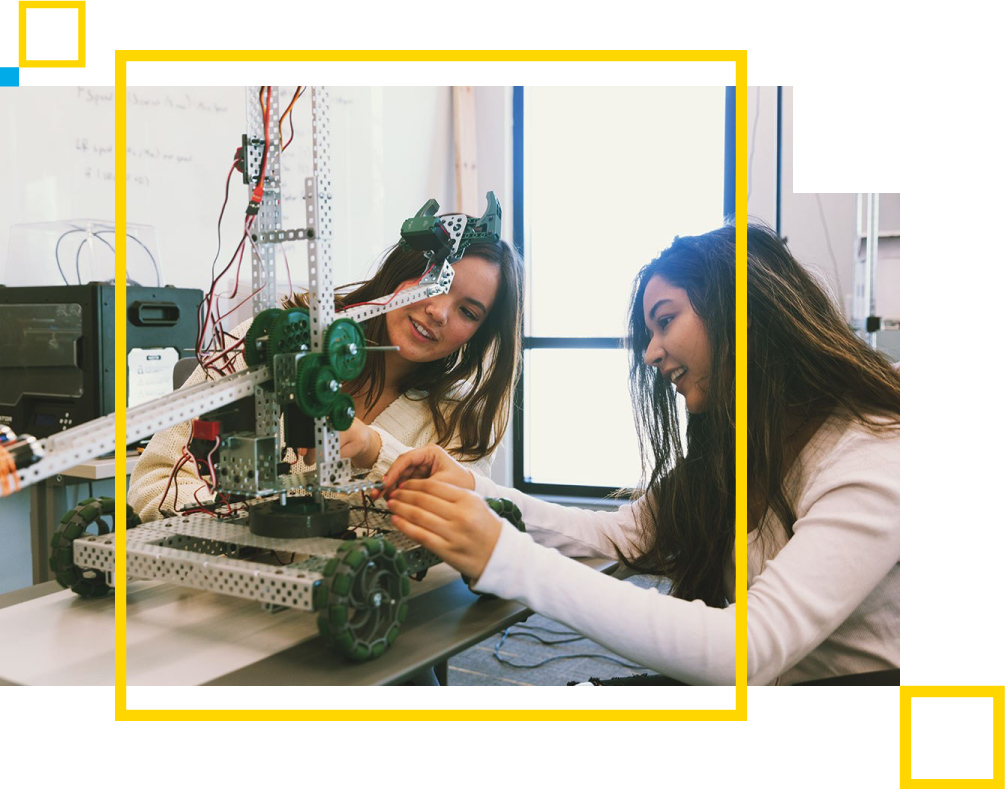 Female STEM students working on robotics building