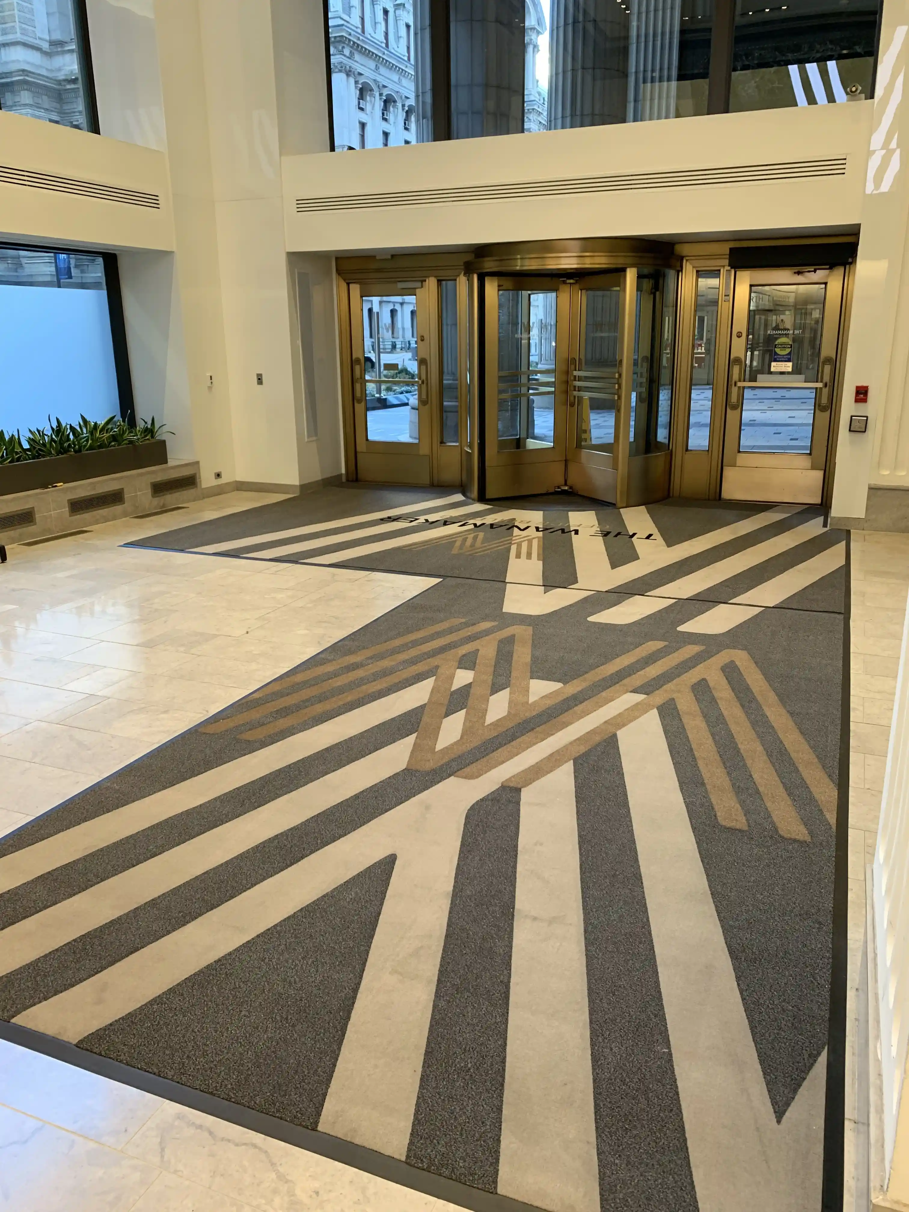 Matting by Design custom logo entrance mat for The Wanamaker Building lobby.