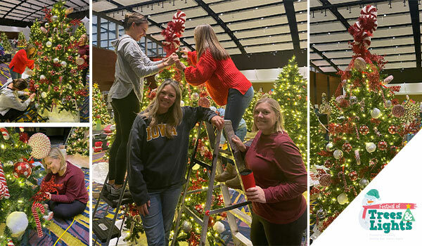 Jill, Katie, and Julie decorating the Two Rivers Marketing tree for Blank Children's Hospital: Festival of Trees & Lights.