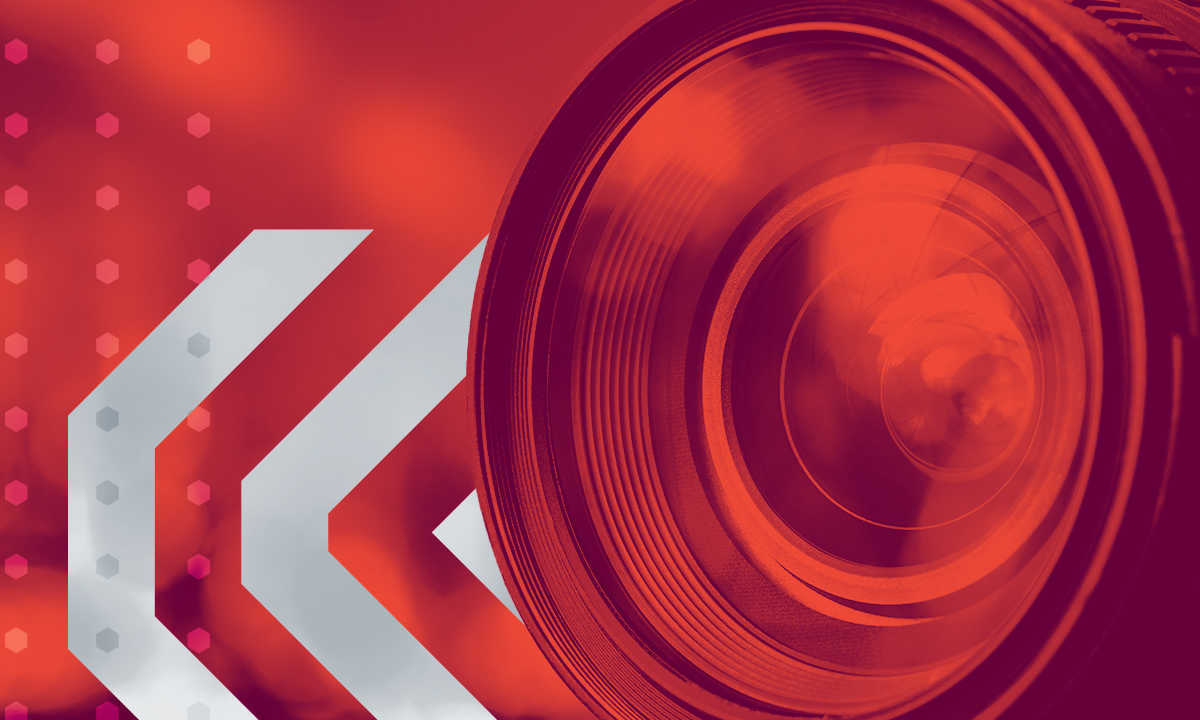 Graphic featuring camera lens and red overlay