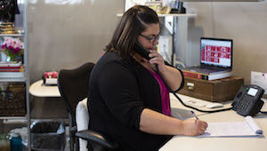 Woman in call center talking on phone