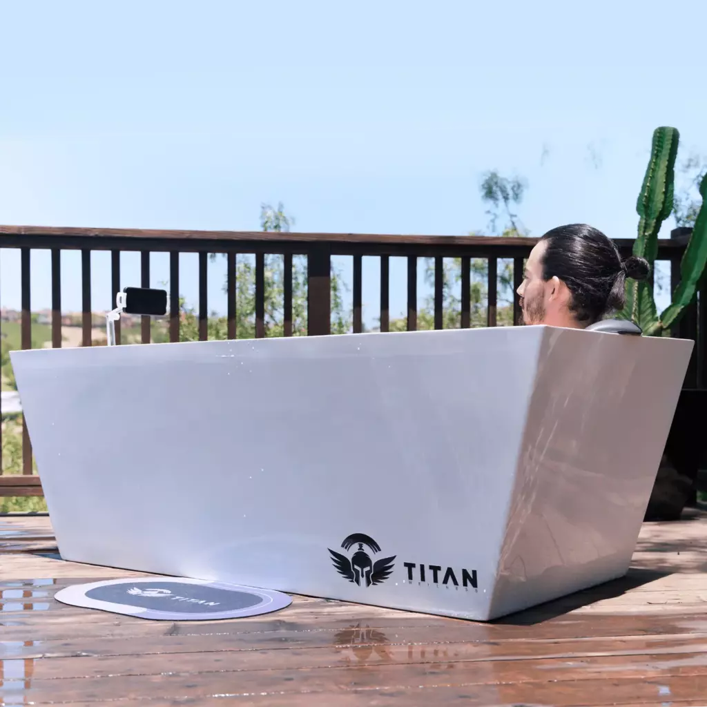 person watching video with the phone holder