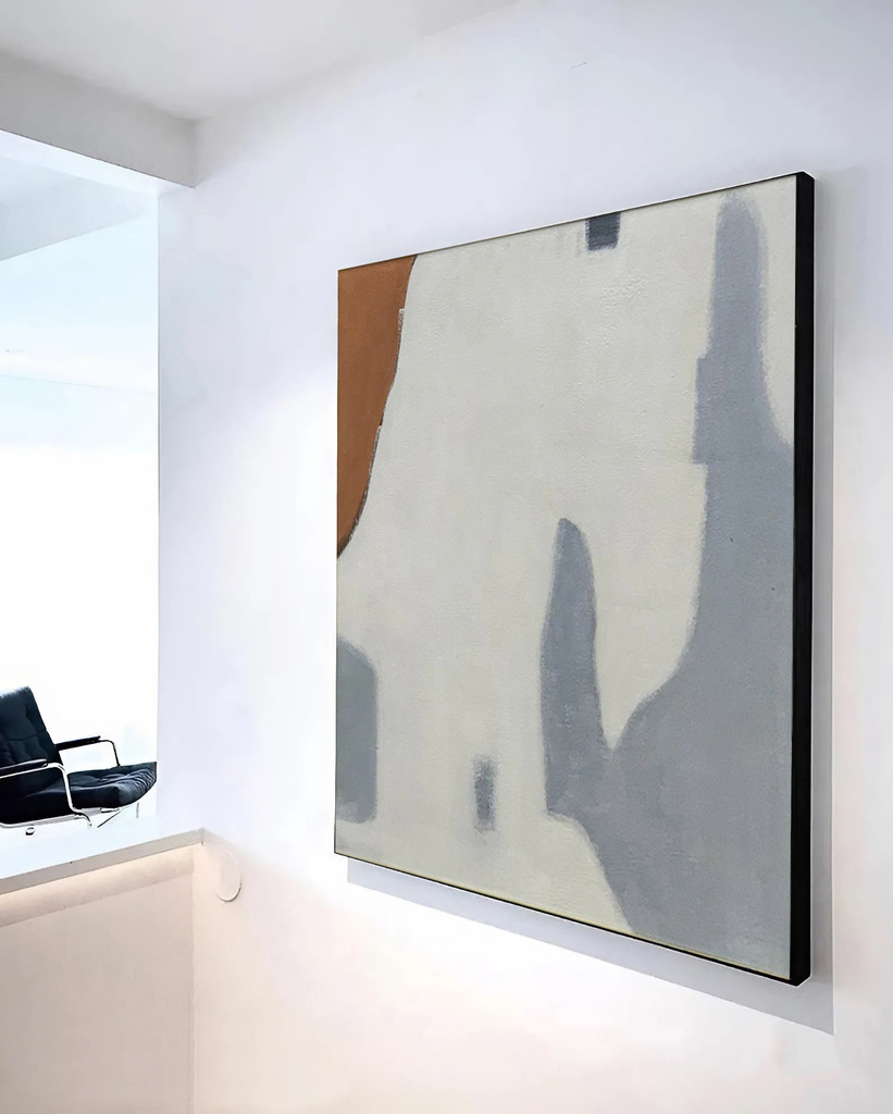 Minimalist wall art, a Noho Art masterpiece: a single, geometric wooden frame in a warm, natural tone suspended against a clean, white backdrop, casting gentle shadows. Soft, diffused lighting from above illuminates the piece, highlighting its elegant simplicity. The frame's sleek lines and understated design create a sense of balance and harmony, drawing the eye to the blank canvas within. This minimalist composition exudes a serene, calming atmosphere, perfect for elevating any living space.
