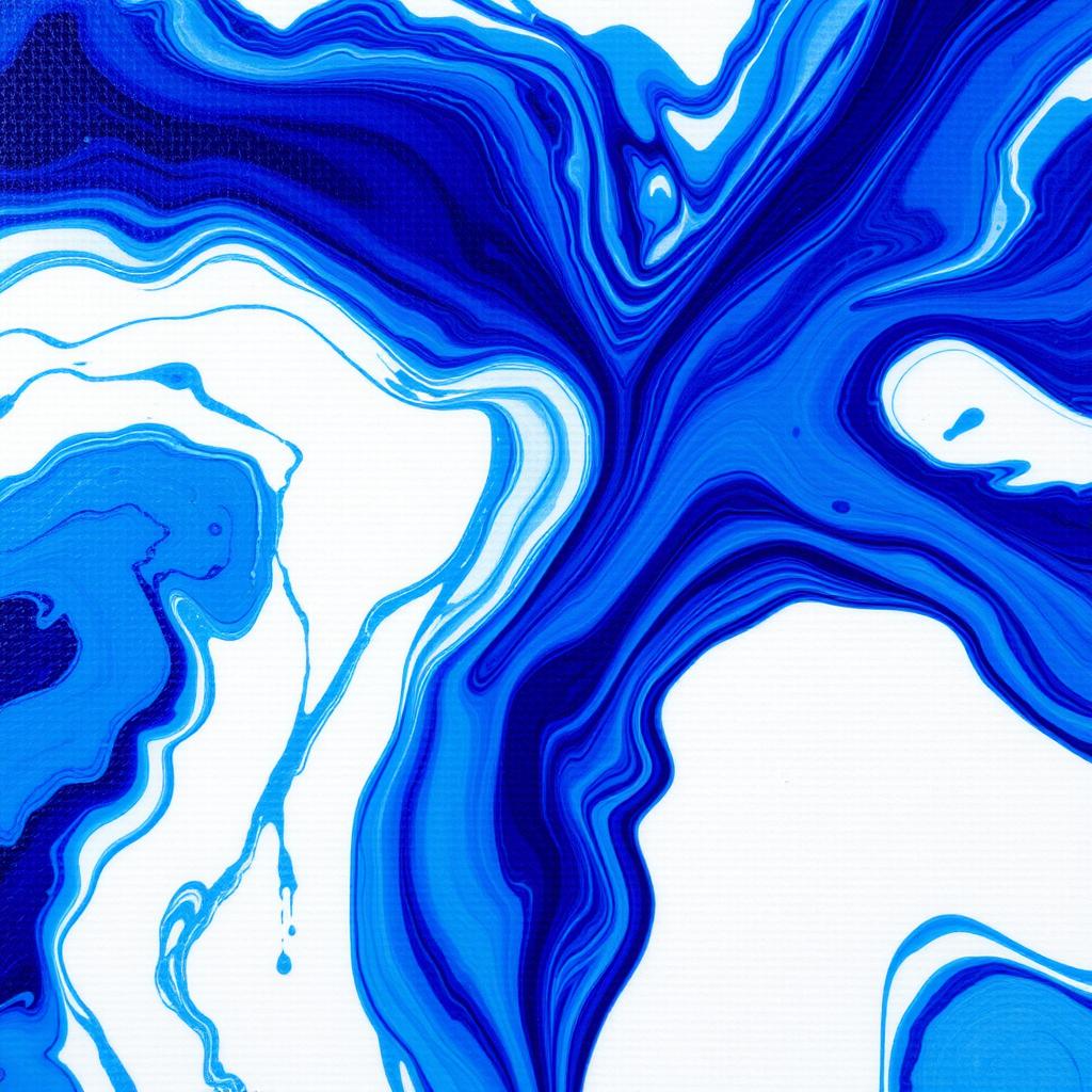 Blue abstract fluid pouring technique demonstration