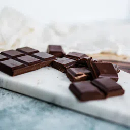 Private label amerpharma no added sugar chocolate, chocolate cubes on the table