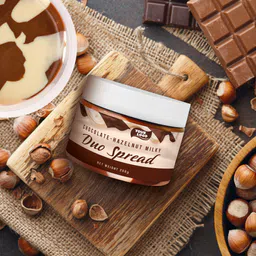 Private label amerpharma chocolate-hazelnut milky duo spread in jar 250 g on table