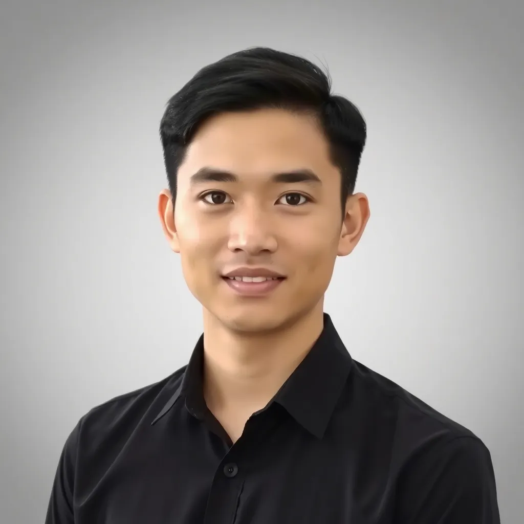 Portrait photo of Firman Syahputra, a young man with short black hair wearing a formal shirt