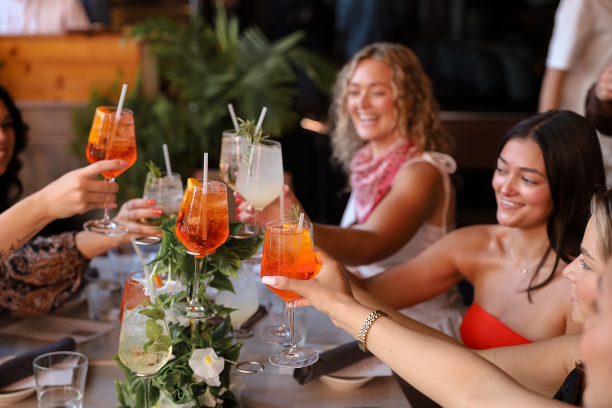people cheersing a spritz tower