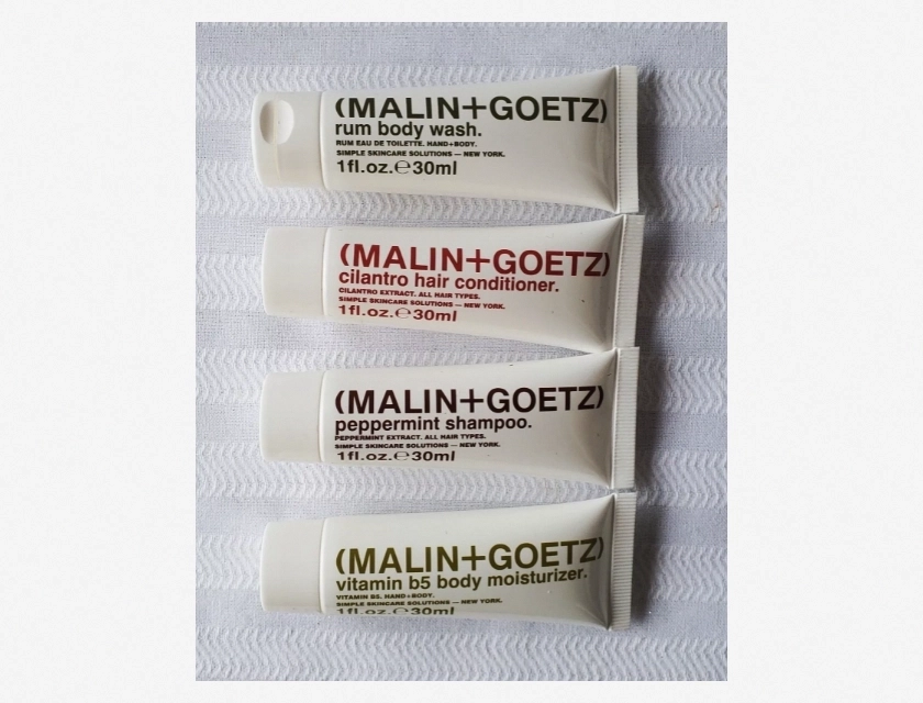 Malin + Goetz Travel Size Set: Shampoo, Moisturizer, Conditioner, Wash – 4 Piece Kit