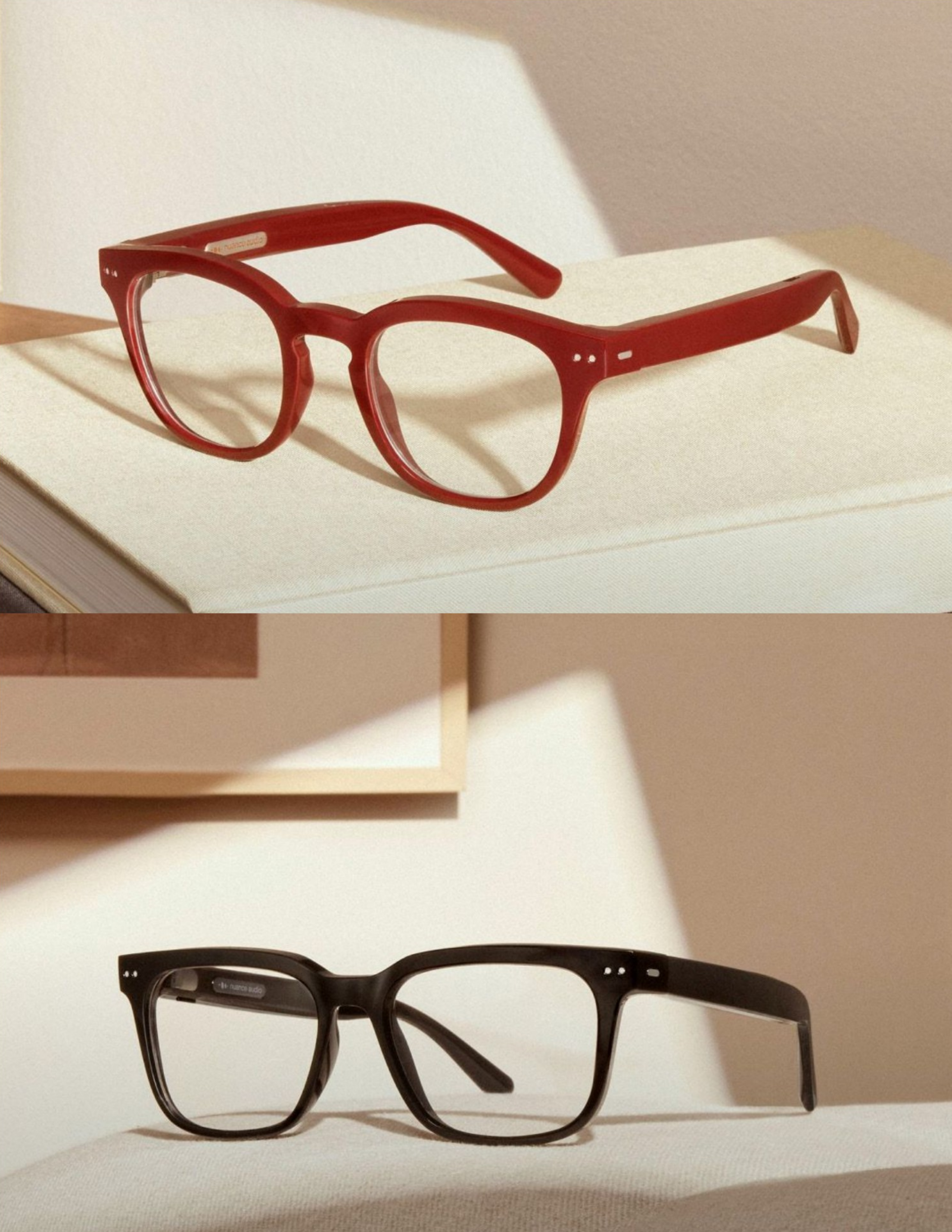 Two Nuance Audio frames photographed on a beige textured book in soft lighting.