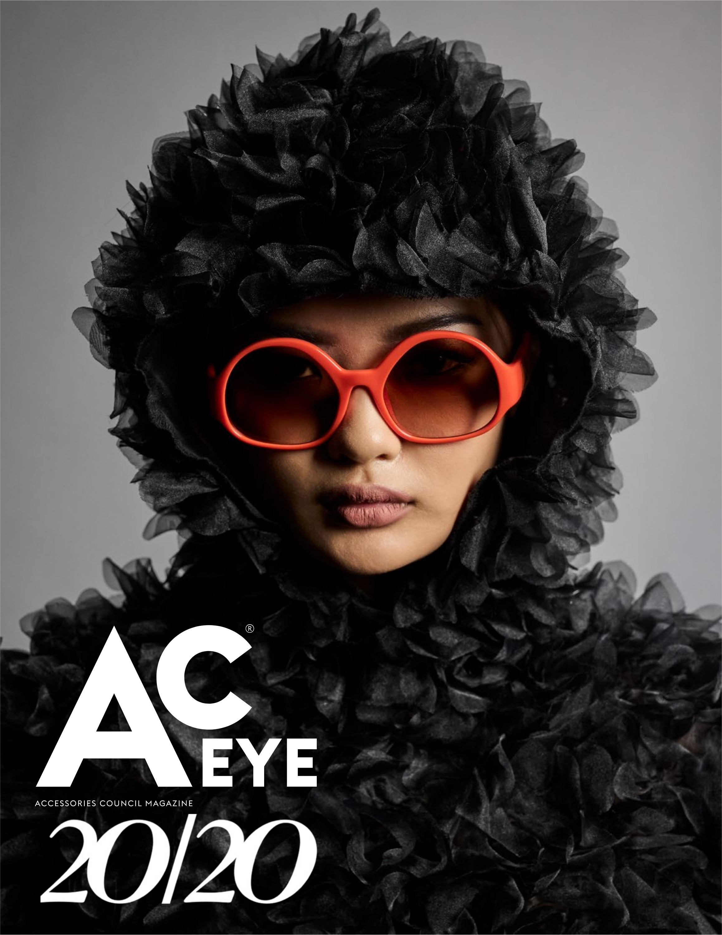 Cover of Ac EYE x 20/20 Fall 2026 Issue featuring model Yan Lui wearing orange Diesel sunglasses and a Comme Des Garcons archival hooded petal dress.