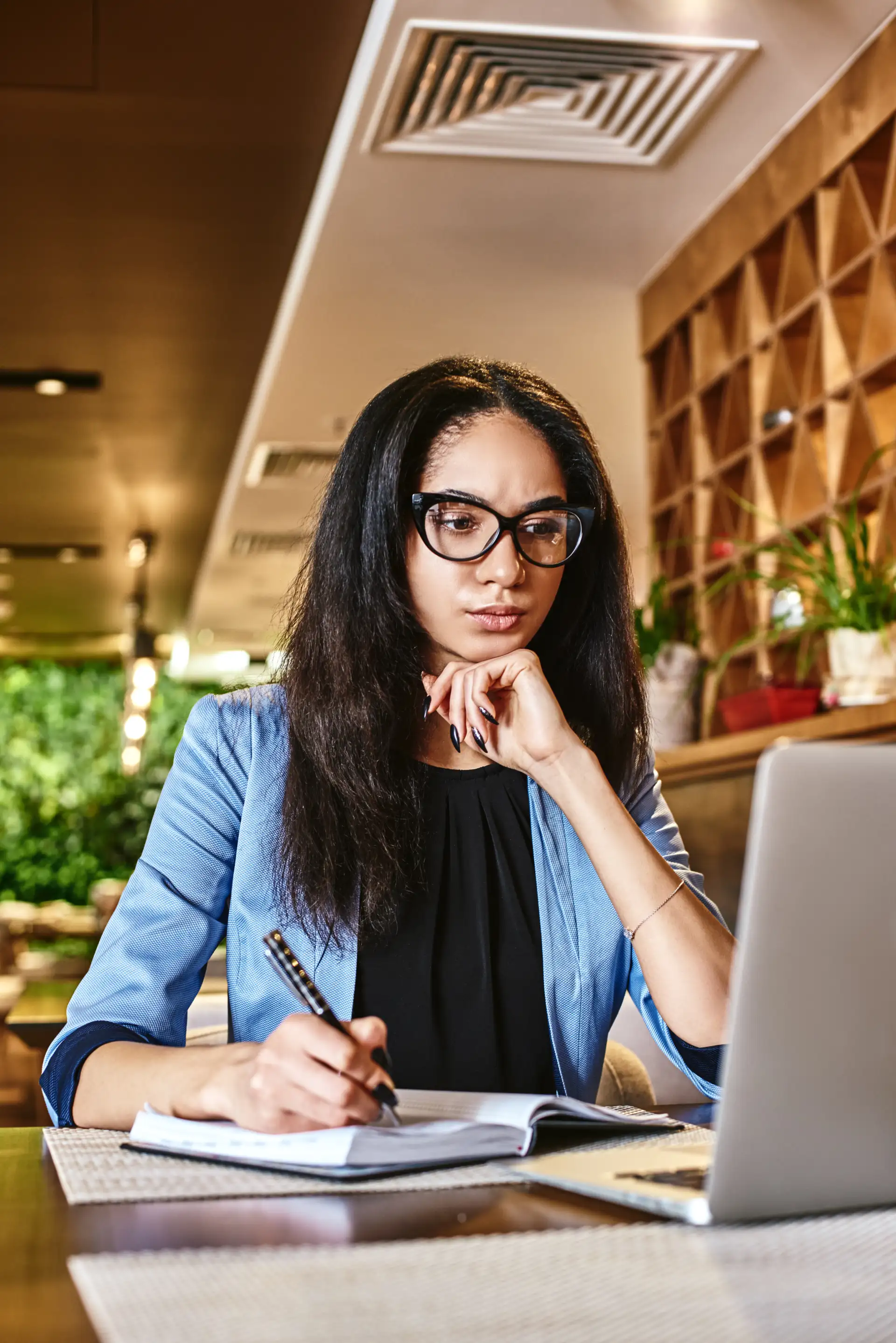 Professional woman working at laptop