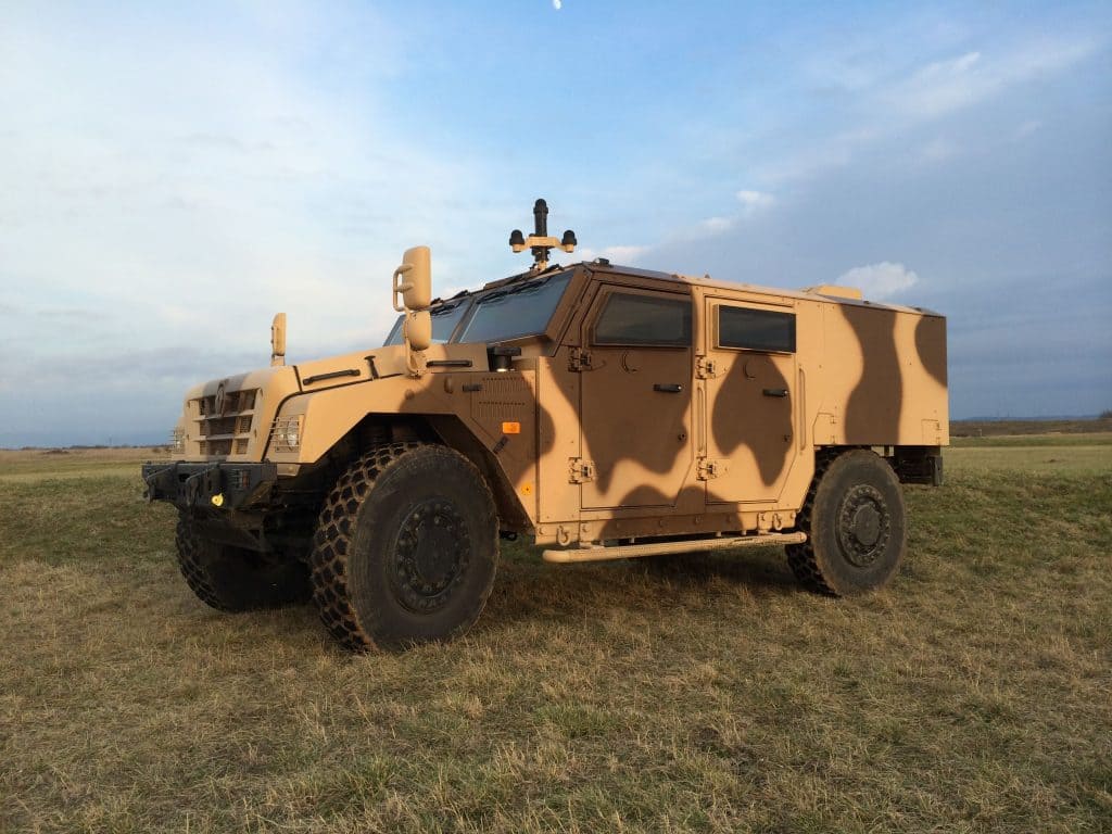 Armored vehicle equipped with acoustic threat detection device