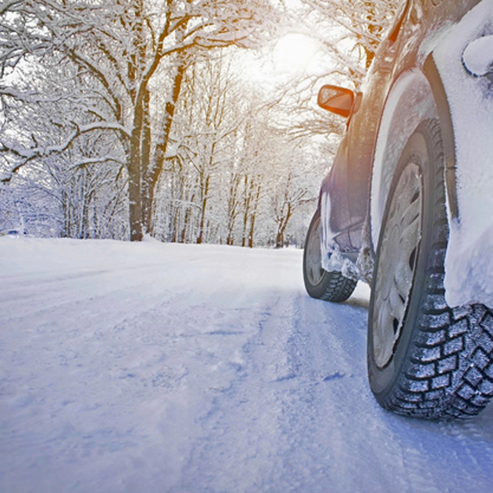Closeup of tires driving on a Winter road