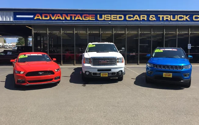 Vehicles lined up in front of Advantage Used Car and Truck Center