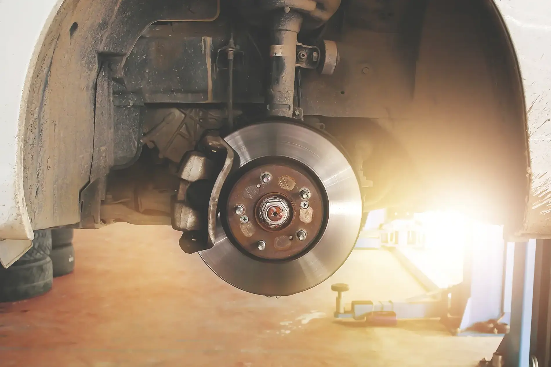 Close up of a brake, rotor and pad on a vehicle