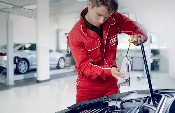 Audi Technician performing an Oil Change