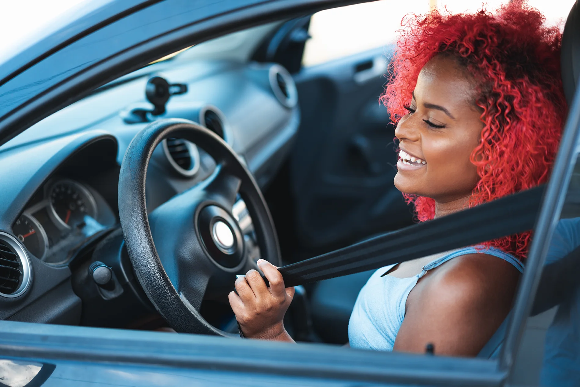 Women smiling in the drivers seat