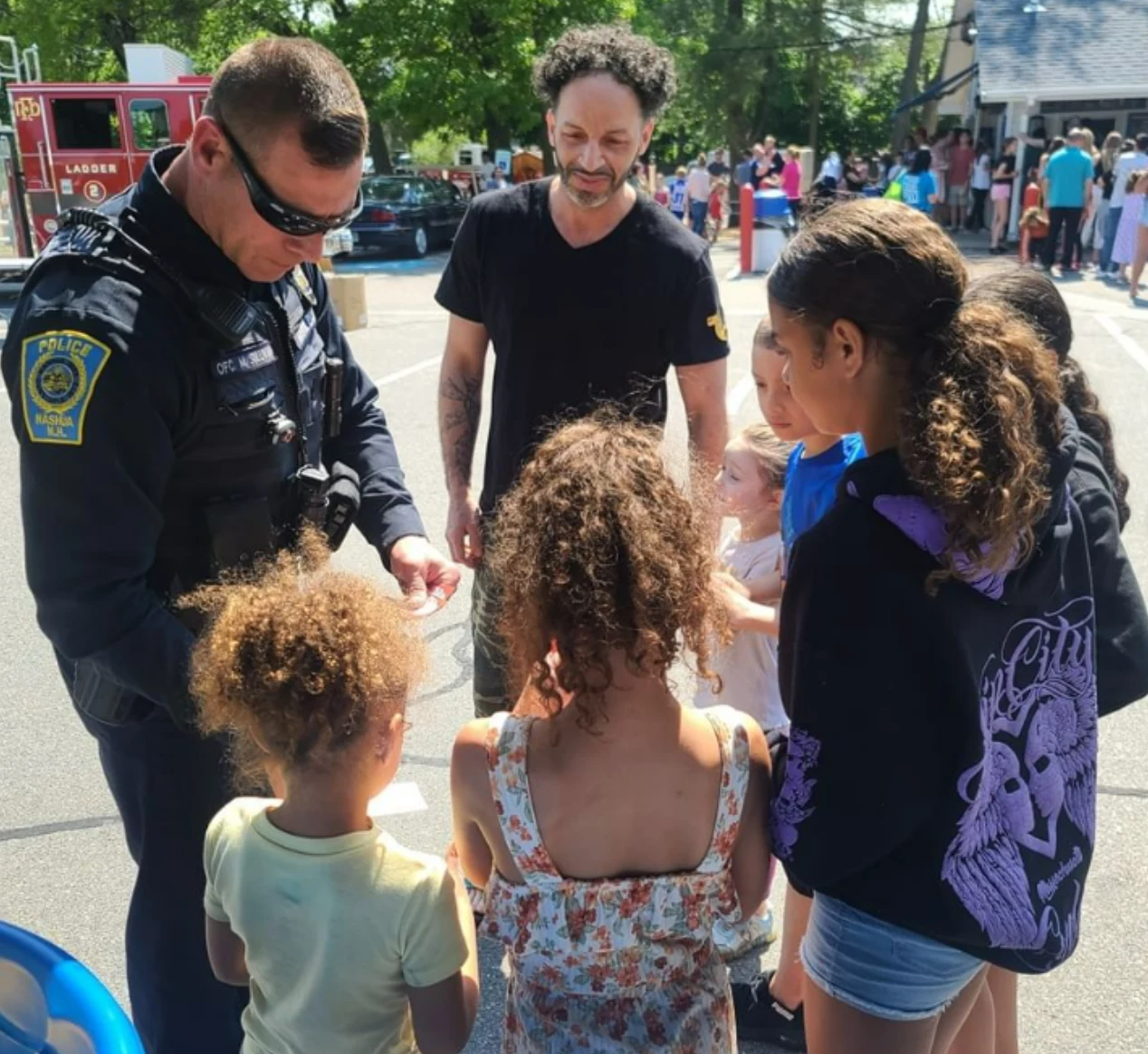 Cop with kids having ice cream outside