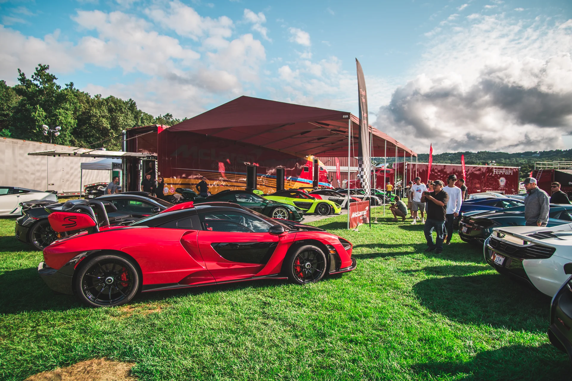 McLaren Boston Dream Ride Experience McLarens parked in field with people taking pictures