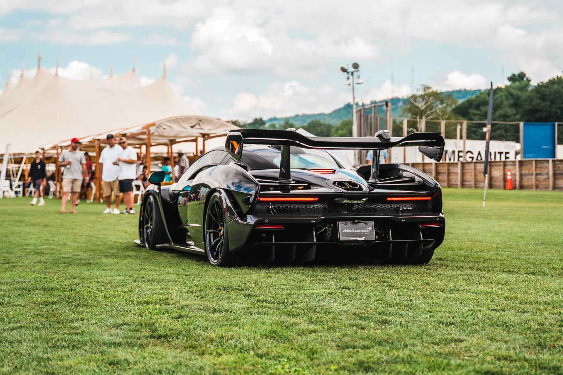 McLaren Boston Dream Ride Experience Black McLaren parked in a field