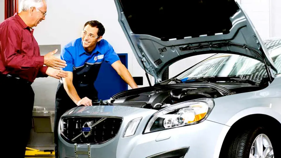 Volvo technician discussing service with a customer