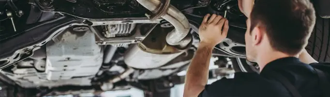 VW Technician performing alignment