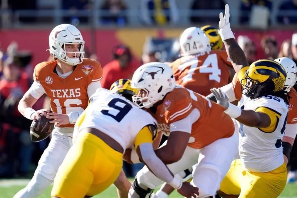 Los Longhorns, con Manning al frente, derrotan a Michigan.