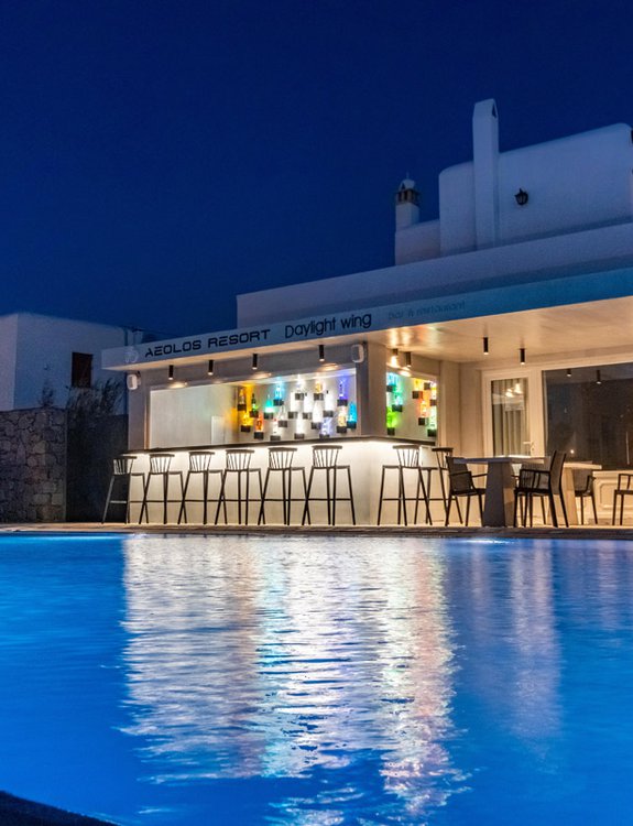 The pool bar of the Daylight Wing during the night with the pool and the sunbeds