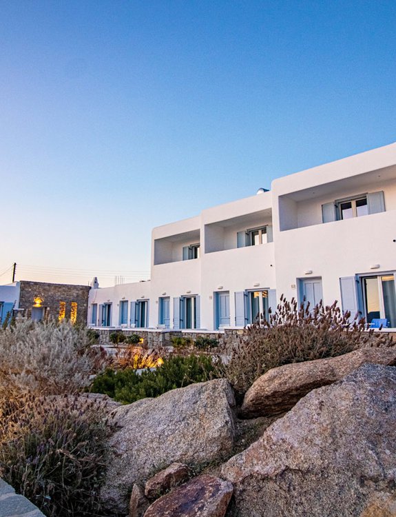 The outside of the rooms of the Sunset Wing, from the center of the section with the greenery