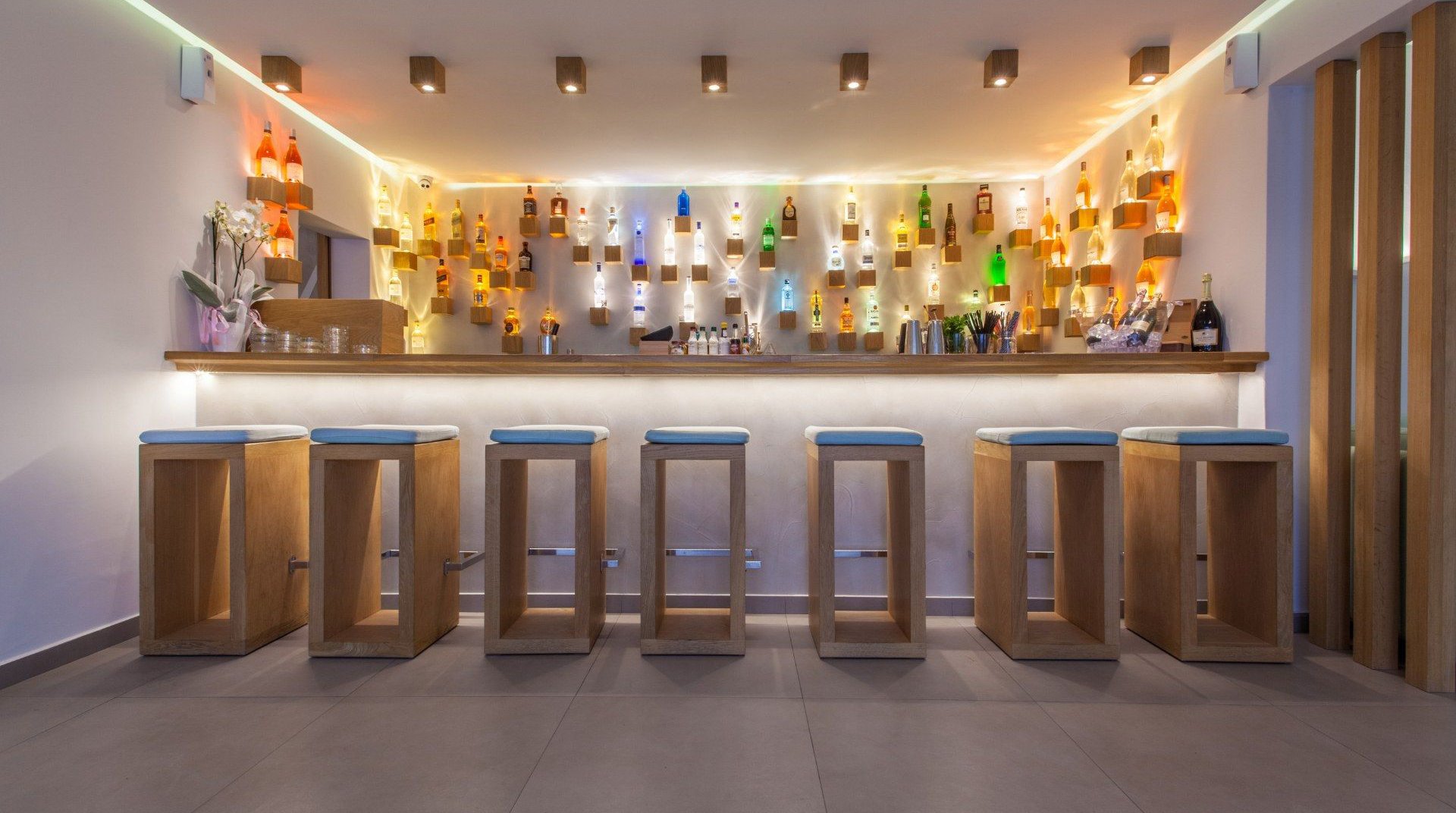 The bar of the resort, with the drinks and the chairs