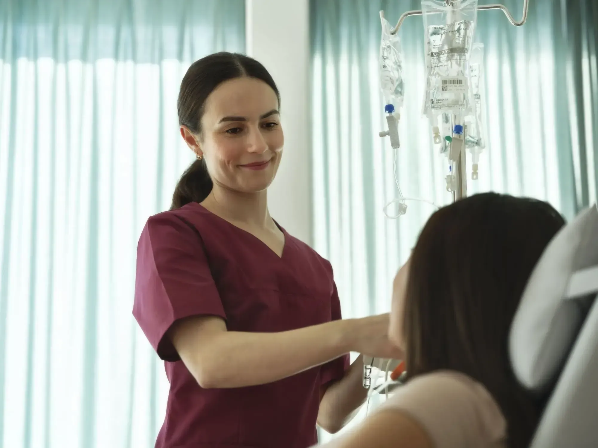 Oncology nurse with a patient