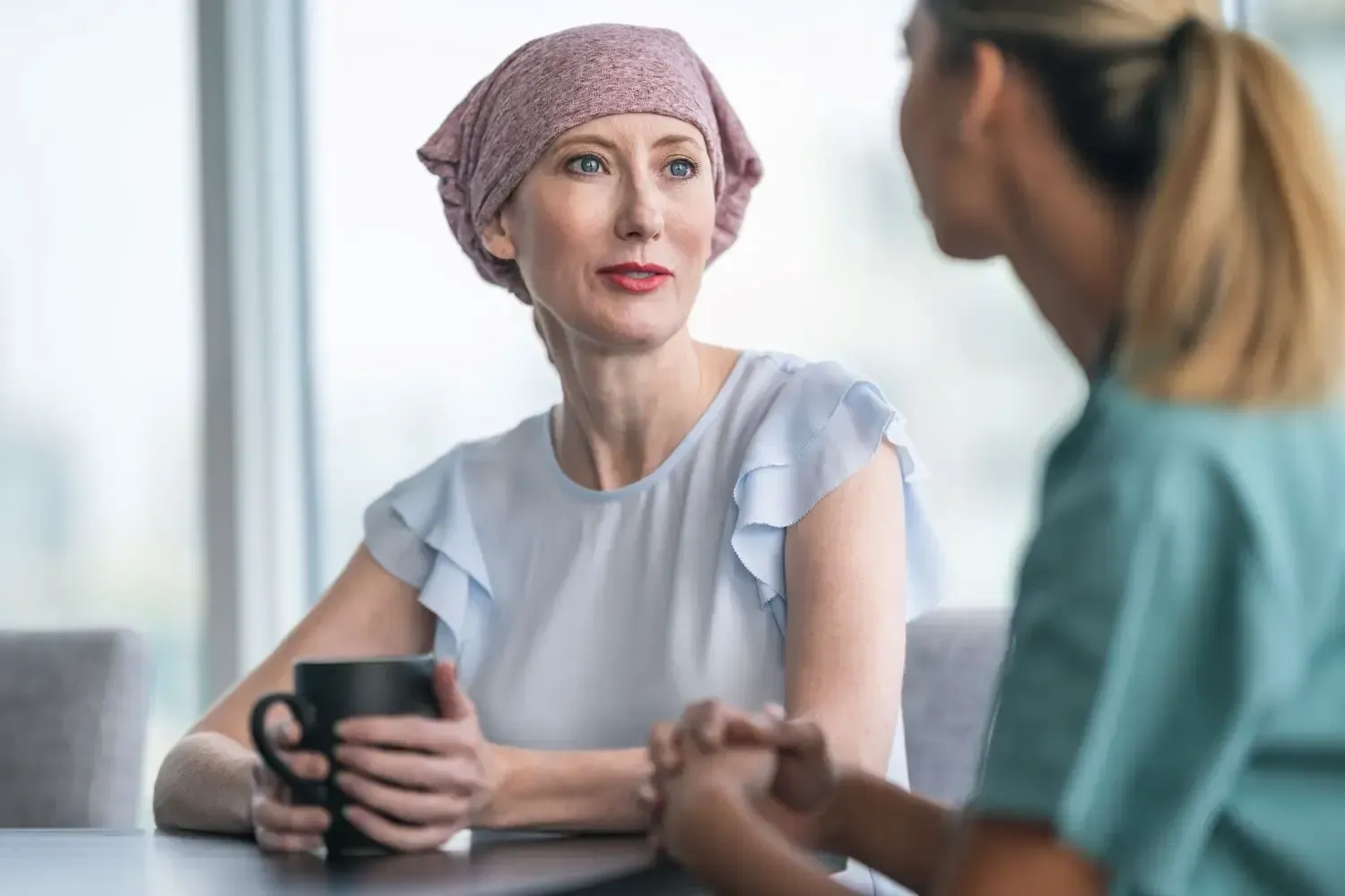 Patient talking with a medical assistant