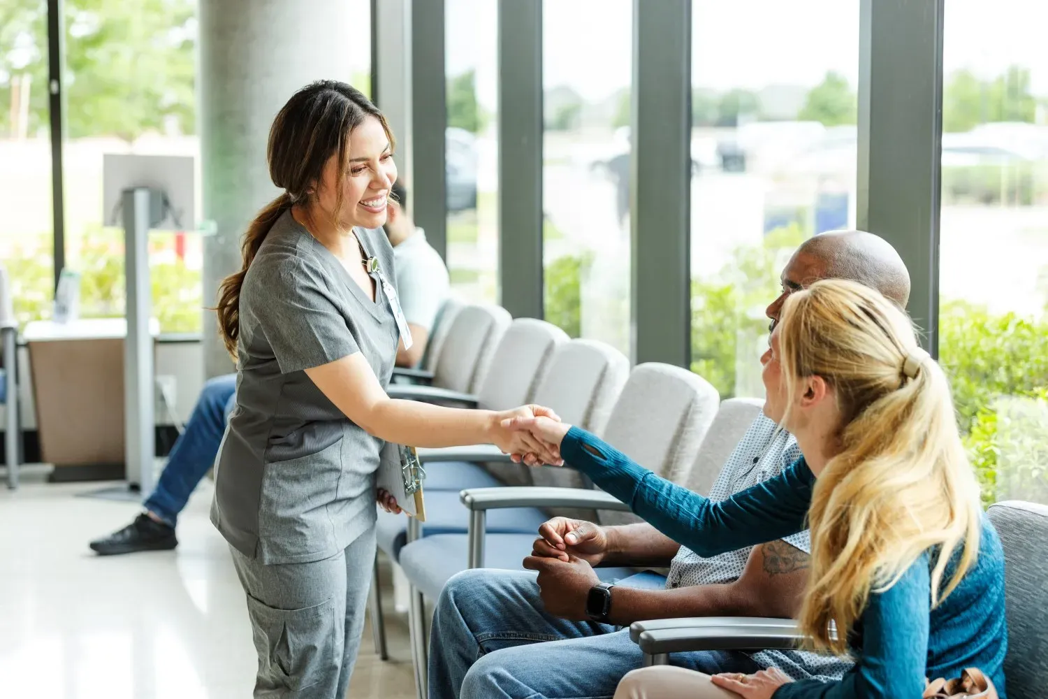 A doctor greeting a female patient