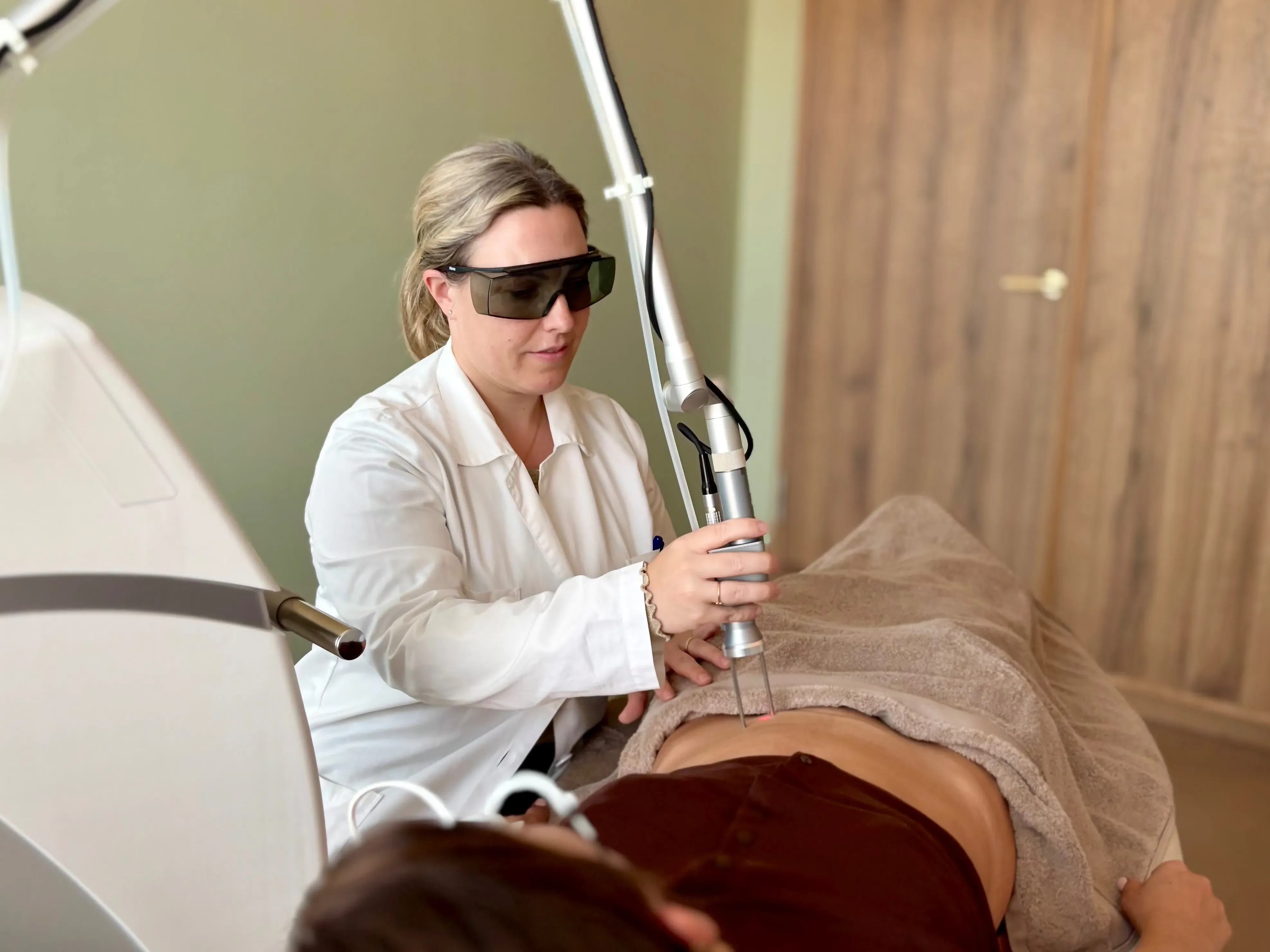 Doctor using a laser