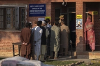 Kashmiri's queue up at a polling booth to cast their vote in Marval, south of Srinagar, Indian controlled Kashmir, Wednesday, Sept. 18, 2024. (AP Photo/Dar Yasin)