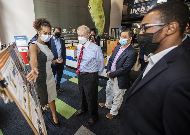 NASA Administrator Bill Nelson, center, listens to engineering students from the FAMU-FSU College of Engineering explain their projects during a visit to the Challenger Learning Center, Friday, Oct. 1, 2021, in Tallahassee, Florida. (Mark Wallheiser/FAMU-FSU College of Engineering via AP)